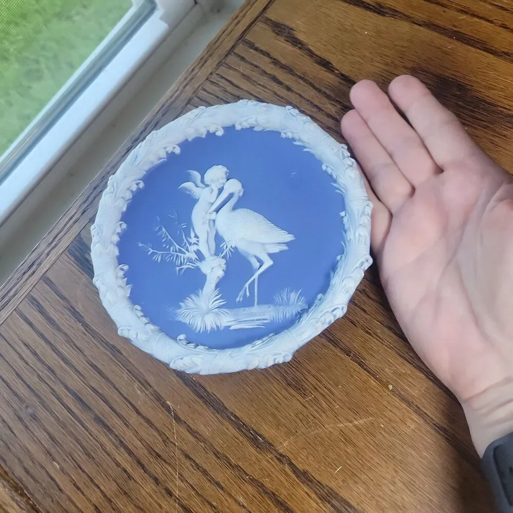 Schafer & Vater Blue & White Jasperware Plaque Featuring a Cherub & Stork Lily